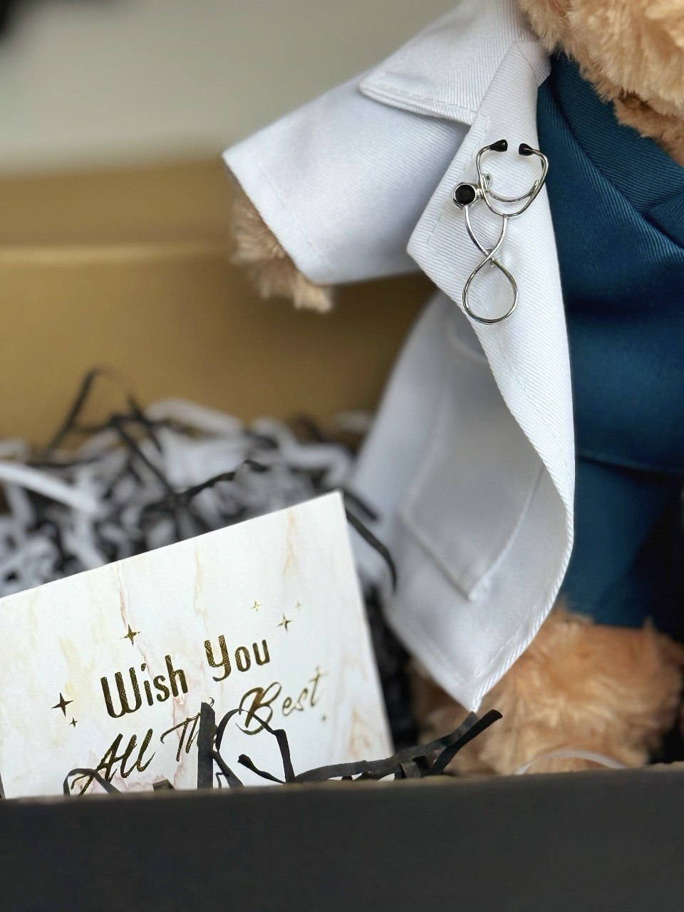 Doctor Bear — A handcrafted teddy bear in a white doctor's coat, teal scrubs, and a miniature stethoscope. Personalised with your recipient's name — the ultimate meaningful gift for a medical graduate.