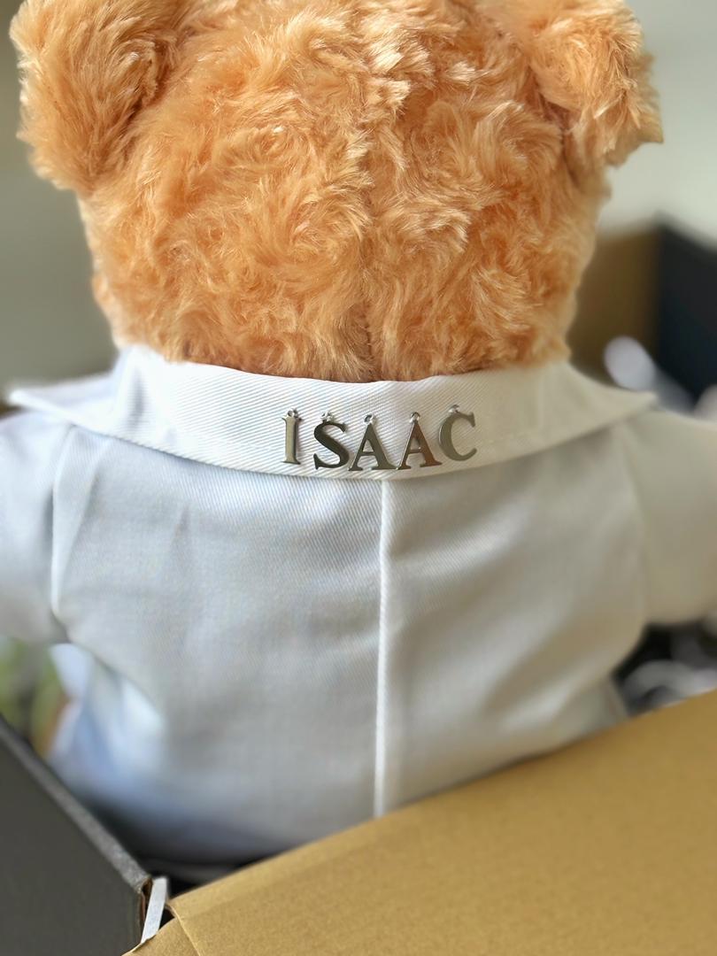 Doctor Bear — A handcrafted teddy bear in a white doctor's coat, teal scrubs, and a miniature stethoscope. Personalised with your recipient's name — the ultimate meaningful gift for a medical graduate.